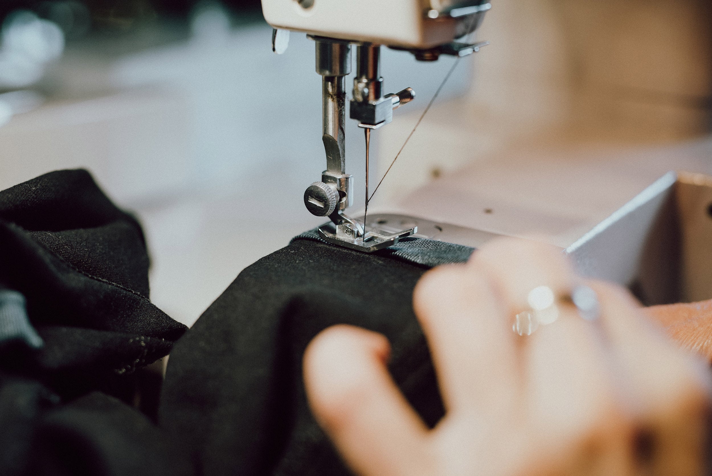 woman-sews-on-the-sewing-machine-2023-11-27-04-55-13-utc-min
